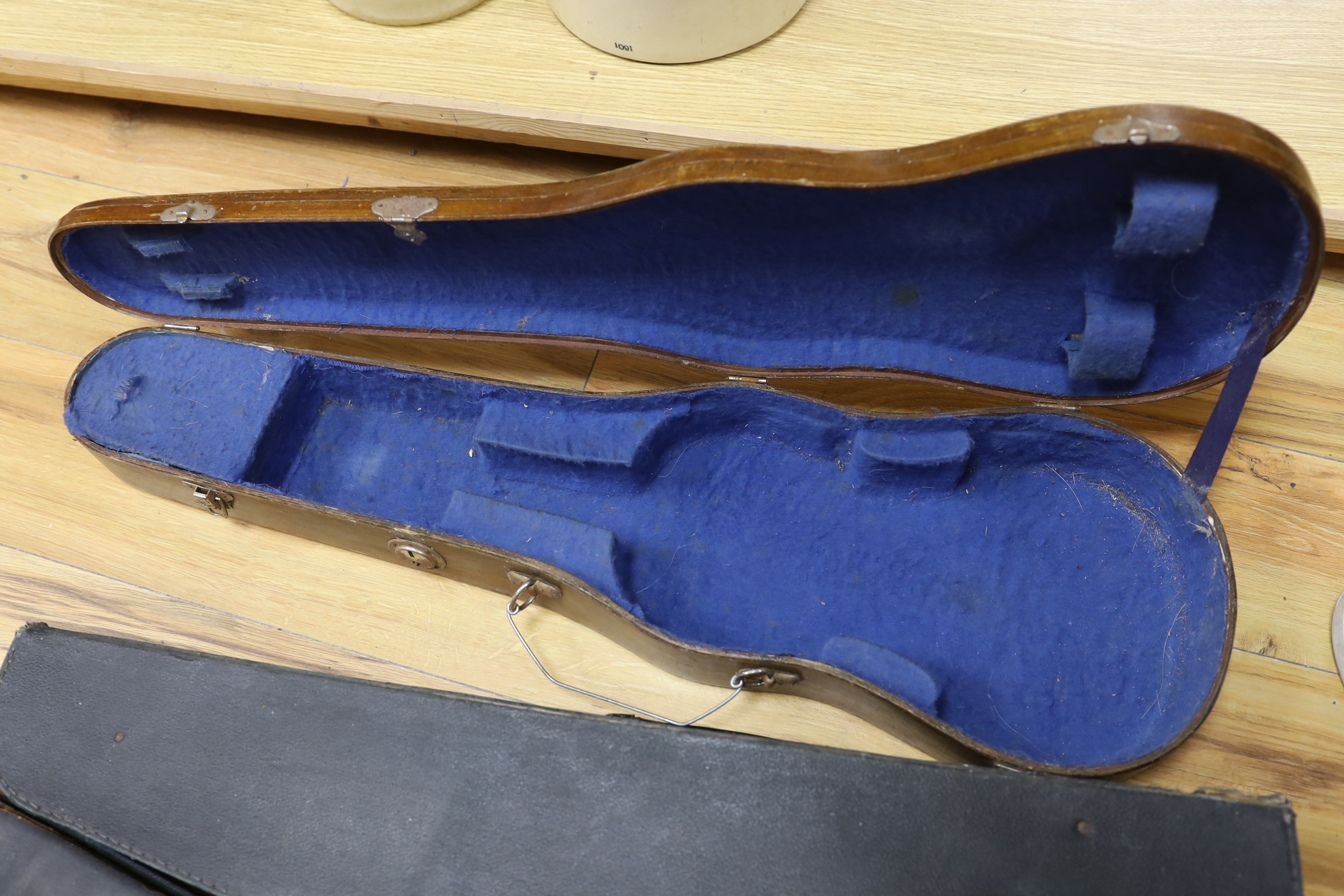 One violin, three violin cases and a cased set of bagpipes